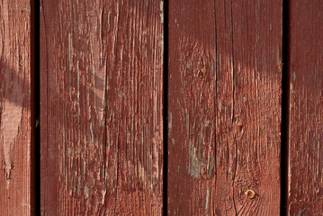 old wooden fence with red paint