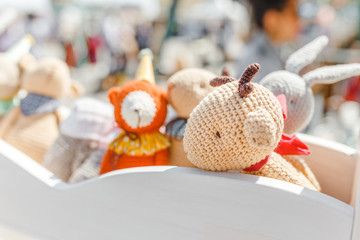 small knitted baby toys for sale at outdoor handmade market