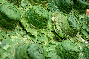 A hat made of green leafs. Close-up photograph.