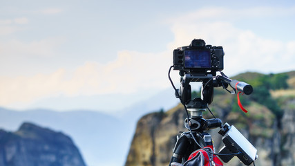 Camera on tripod and Meteora monasteries