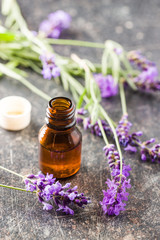 Fototapeta na wymiar Essential oil and lavender flowers.