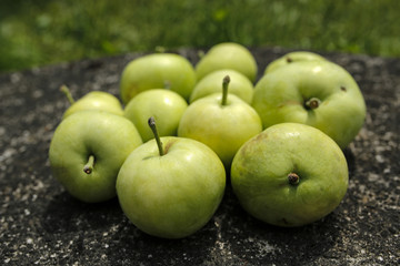 green apples on stone
