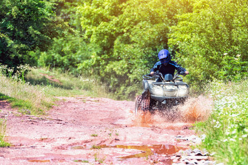 A trip on the ATV on the red road.