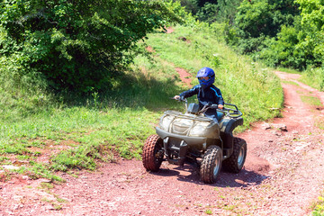 A trip on the ATV on the red road.