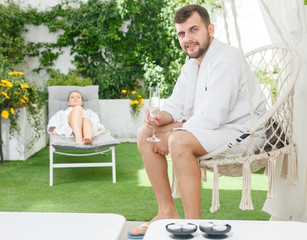 Man with sweetheart in spa resort outdoors