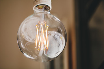 Hanging retro bulb in a cafe