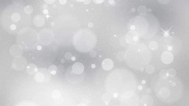 Beautiful silver colored blurry circle bokeh with sparkle motion background. Christmas and New Year copy space decoration animation.
