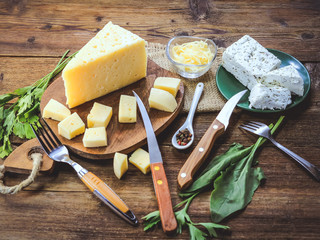 sliced cheese on a wooden board
