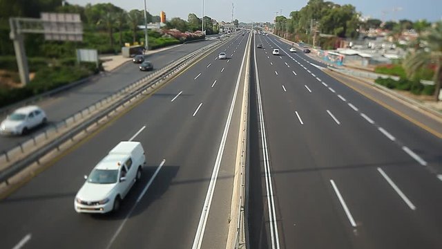 cars are moving along the highway in the city of Netanya Israel. view from above