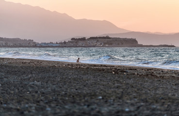 Sunset and stormy sea near Rethymno town on the island of Crete. Greece