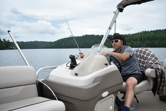 Man Fishing While Riding Pontoon