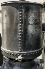 Details of an old tresher machine on a court in Csernat, Transylvania, Romania