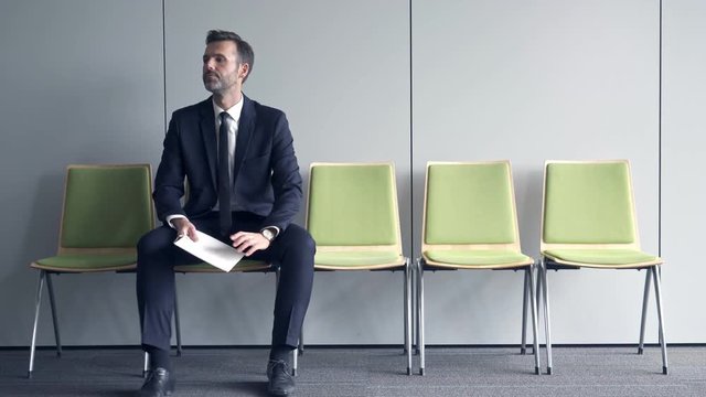 Stressful man waiting for job interview