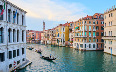 Obraz premium Canal Grande with boats and lights in Venice at Sunset. Next to famous Rialto Bridge and the Street 