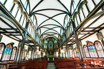 Interior of ancient Catholic wooden church in Kon Tum, Vietnam, Asia. - Powered by Adobe