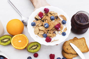 cup of cereals with natural fruits, healthy and balanced breakfast