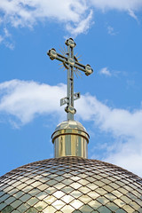 Fototapeta na wymiar The dome of the Church with a cross