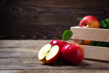Fresh red apples on wooden background