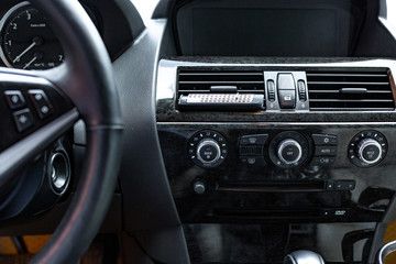 Obraz na płótnie Canvas car interior. Modern car speedometer and dashboard. Luxurious car instrument cluster.