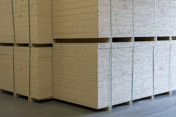 Warehouse of fiberboard and chipboard. Construction Materials. Wooden warehouse.
