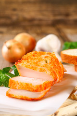 Pork lard with greens on a wooden table.