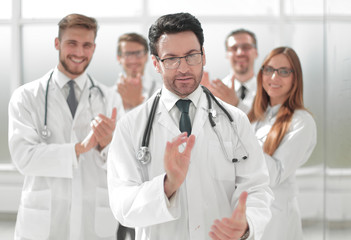 successful doctor, accepting congratulations from colleagues