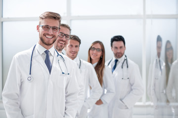 team of doctors standing in the hospital corridor