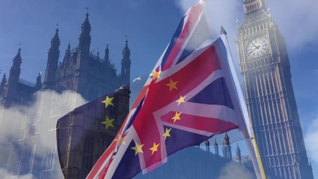 UK Union Jack flag flying in front of Westminster Palace in London with EU flag overlay in a double exposure