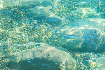 the stones under the clear water