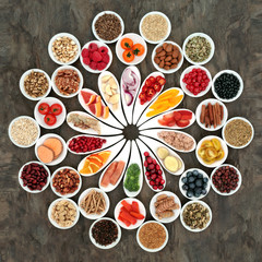 Large health food collection for a healthy heart with fruit, fish, vegetables, nuts, seeds and...