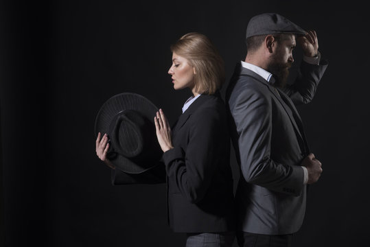 Fingerprinting to solve crimes. Old fashioned approach. Couple detective investigators partners. Partnership clever intelligent reporter investigator. Man and blonde lady dressed formal old fashioned