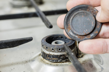An old dirty gas kitchen. Device for preparing dishes in the kitchen.