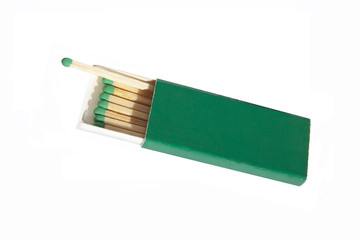 Green matches in the open  sandpaper matchbox, isolated.