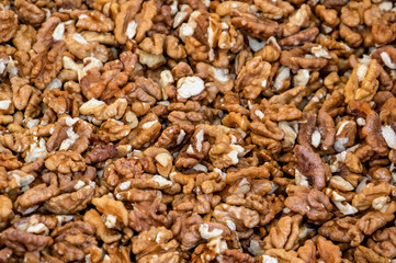 Fresh peeled walnuts at street market. Walnut kernel. Organic food concept