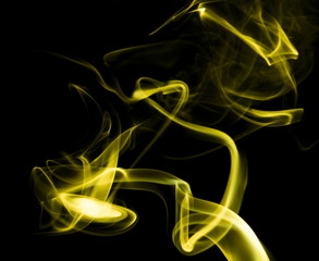 Yellow smoke on black background