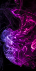 Colored smoke on black background