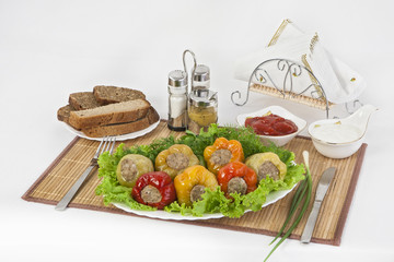 Bulgarian pepper stuffed with meat with herbs sauce and sour cream. A fine meal for lunch.