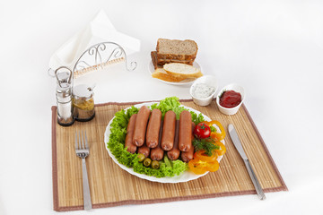 Sausages smoked with tomatoes, cucumbers and greens. Served with black or white bread.