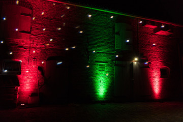 red and green dj ambient lighting on a barn at a vintage wedding