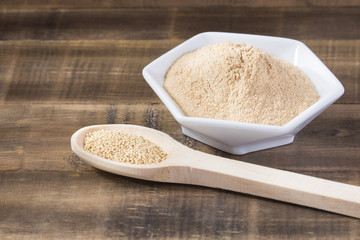 Raw amaranth seeds in wooden spoon - Amaranthus. Top view