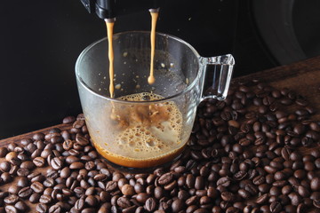 coffee glass coffee beanson a stone background a coffee machine