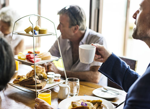 Friends having breakfast at a hotel