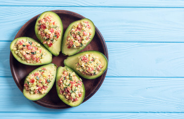 Avocado stuffed with cucumber , tomatoes and eggs