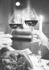 Couple making a toast at a romantic dinner