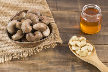 Natural and roasted cashew nut on the table - Anacardium occidentale
