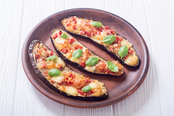 Eggplant with tomatoes , cheese and basil