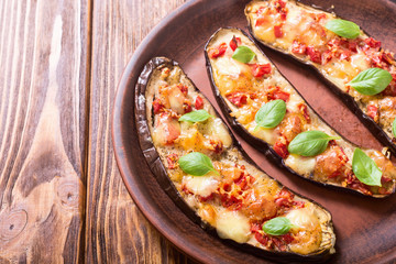 Eggplant with tomatoes , cheese and basil