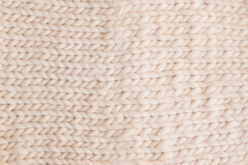  beige texture of knitted wool fabric, background concept
