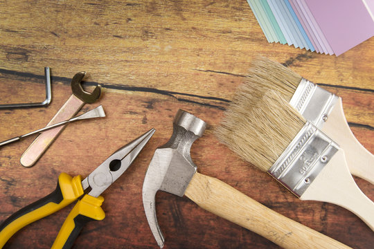Tools and Needed Things for Home Improvement on a Wooden Table