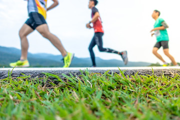 Chiang Mai, Thailand - June 17th, 2018 : Feet of Chiang Mai people running in marathon running race on June 17th, 2018 in Chiang Mai Thailand